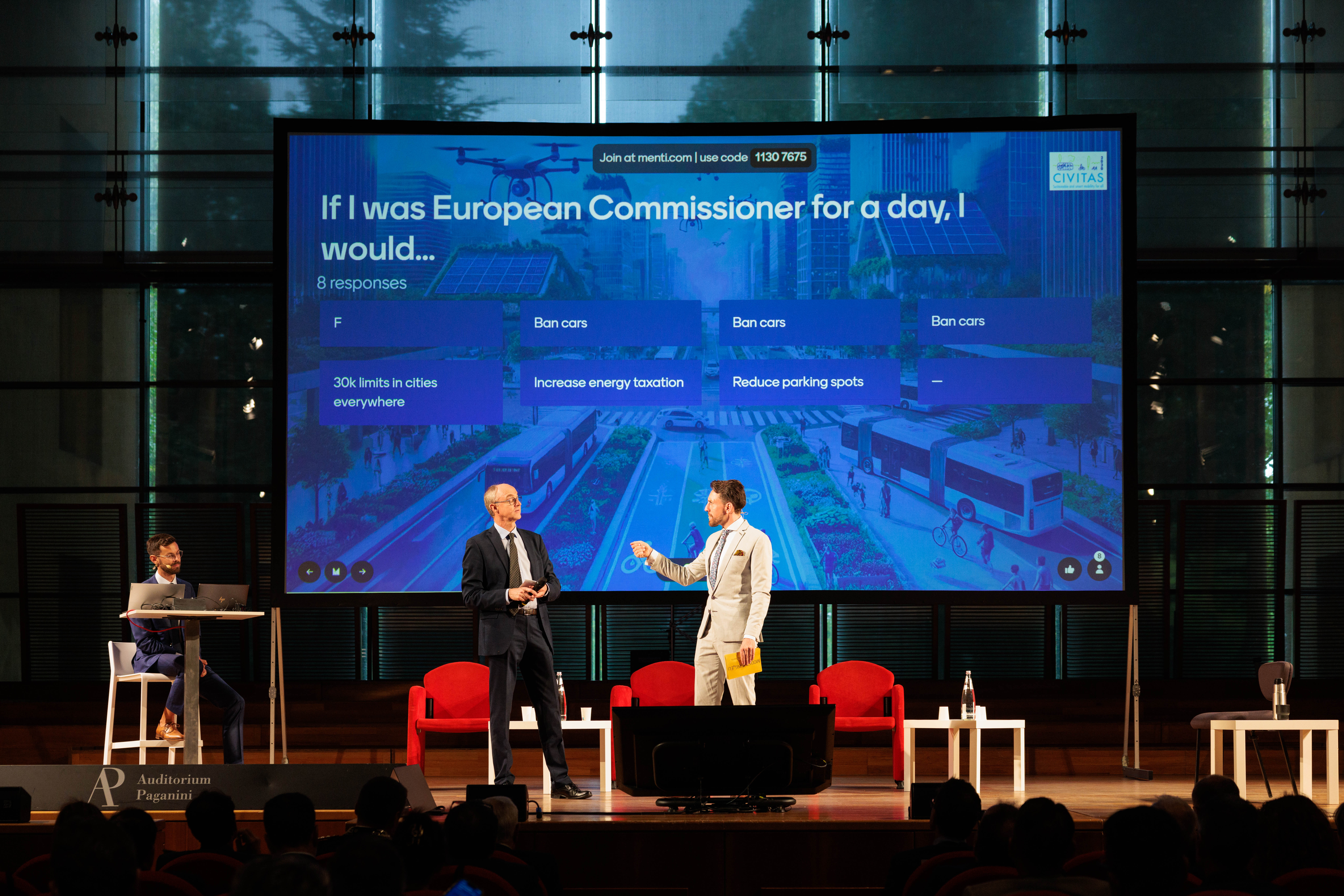 Audience voting on screen during a Brussels policy event