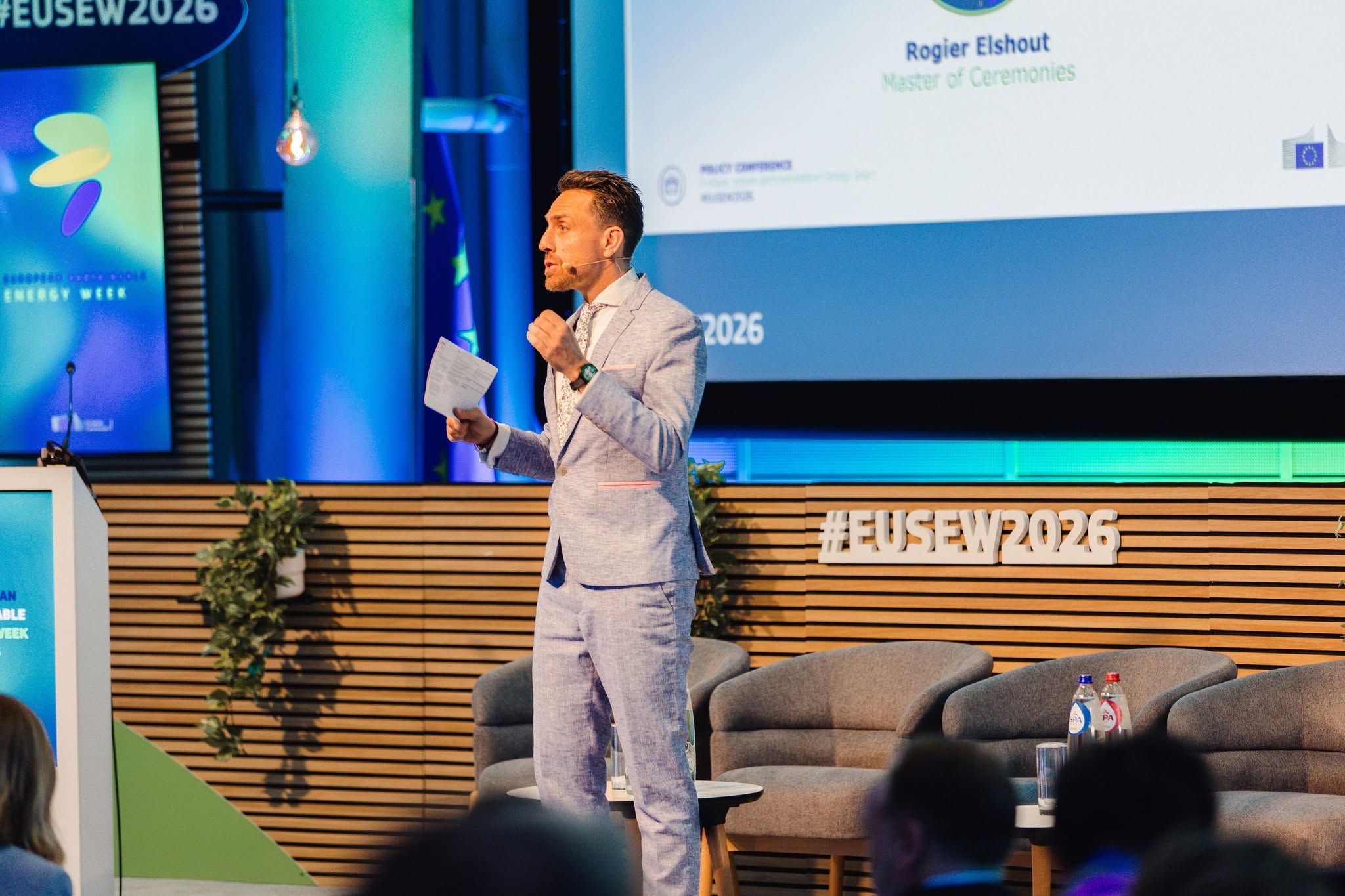 Moderator opening a European policy conference